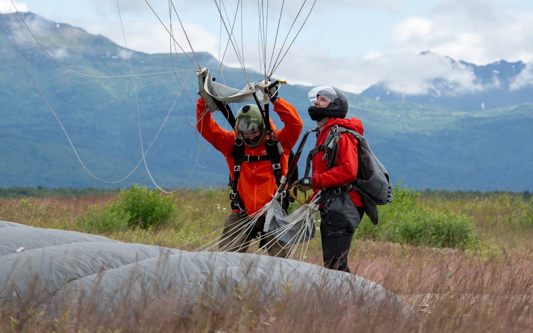 Alaska Air National Guard pararescuemen from the 212th Rescue Squadron conduct airborne operations from an Alaska Army National Guard CH-47F Chinook helicopter at Malemute Drop Zone, Joint Base Elmendorf-Richardson, Alaska, July 9, 2024. The Guardsmen of the 212th RQS and the 3rd Air Support Operations Squadron Tactical Air Control Party special warfare Airmen conducted joint airborne training to maintain the pararescue jumpers' proficiency in conducting full-spectrum personnel recovery to include both conventional and unconventional rescue operations and the TACPs to direct lethal and nonlethal joint firepower whenever necessary.