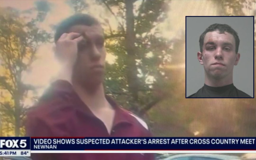 High school cross-country runner attacked during race by man disguised in opponent's jersey who appeared from the woods, then escaped back into the trees: Cops